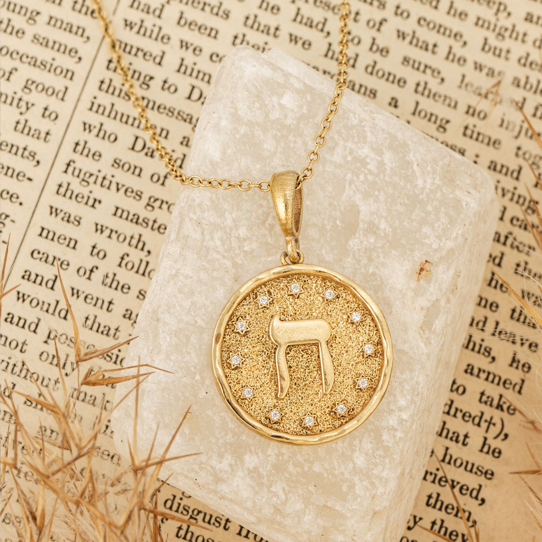 Chet pendant on cream stone on text