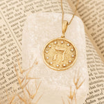 Hey pendant on cream stone on text