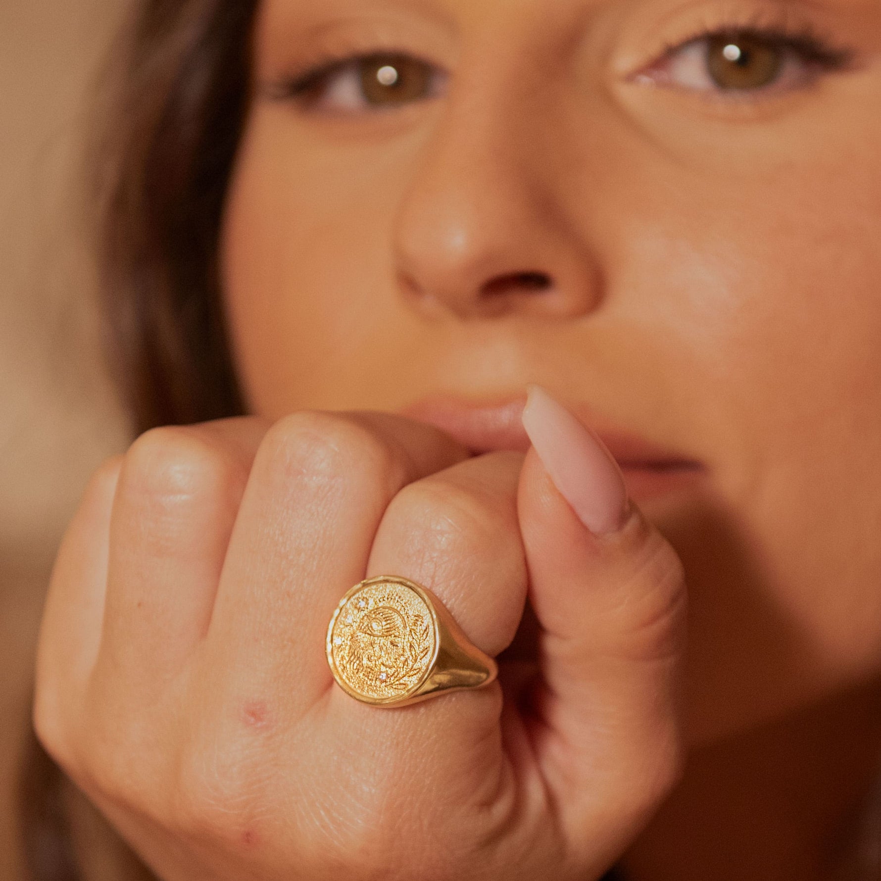 Rebecca Ring on model’s finger, close-up showing intricate detail