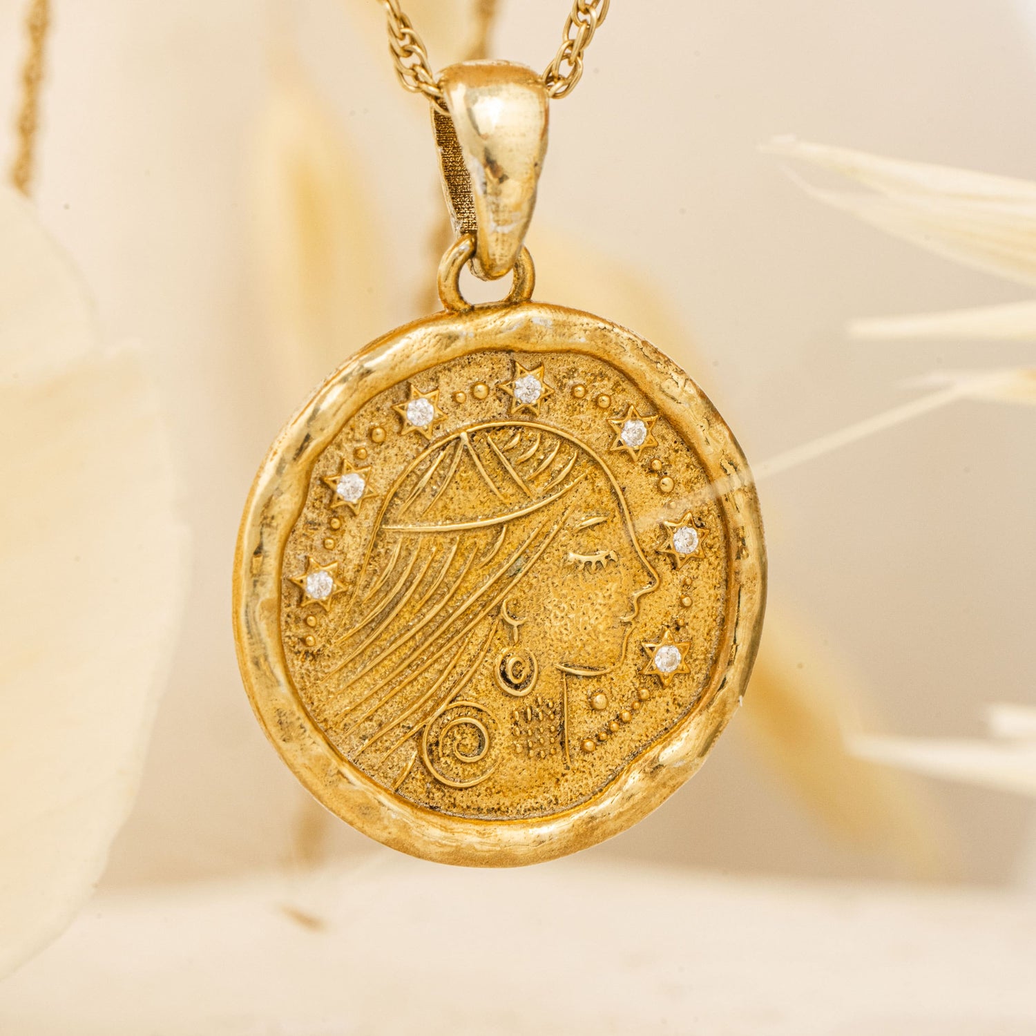Sarah Pendant hanging against cream background with soft shadows