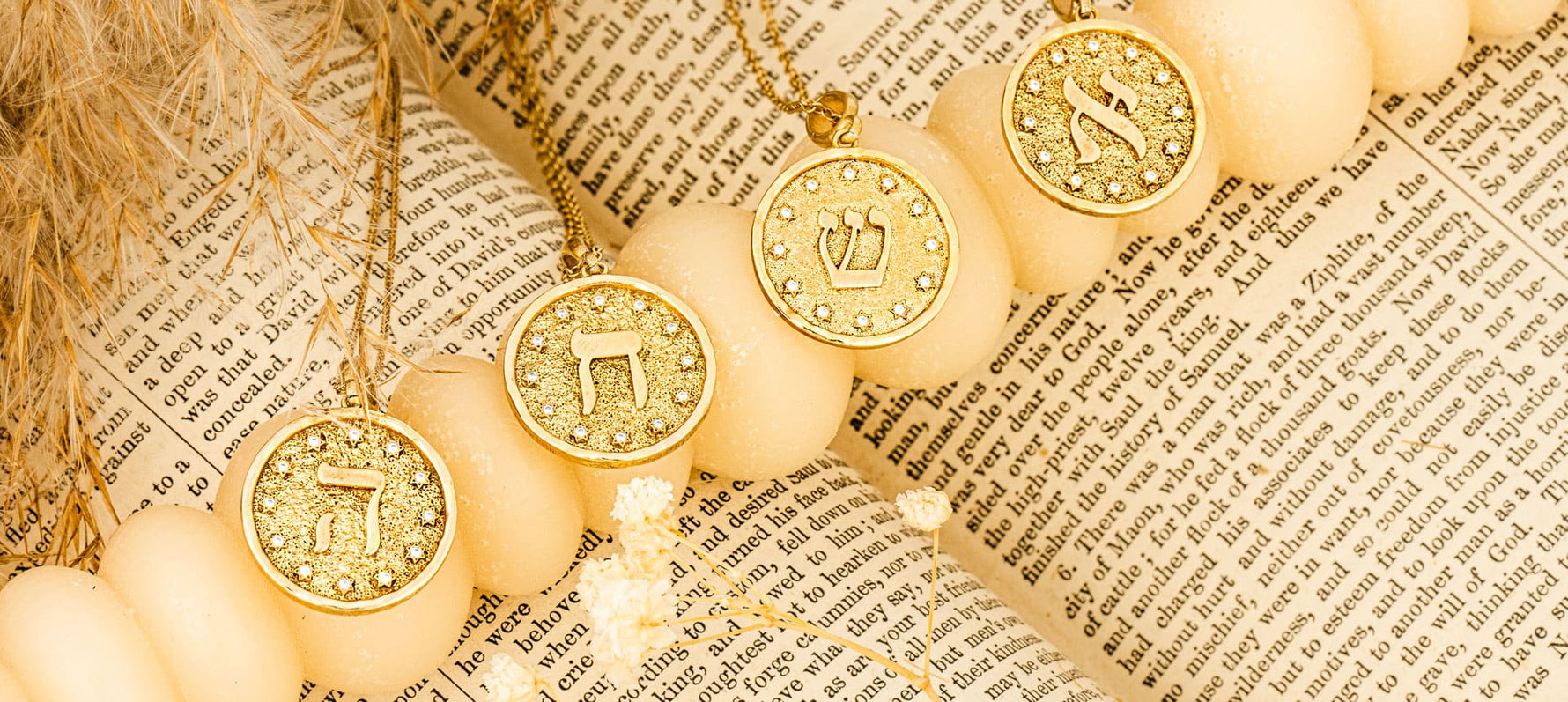 Close-up of Hebrew letter pendants in 14k gold – Aleph and Shin from the Letters of Light Collection by Sages & Souls