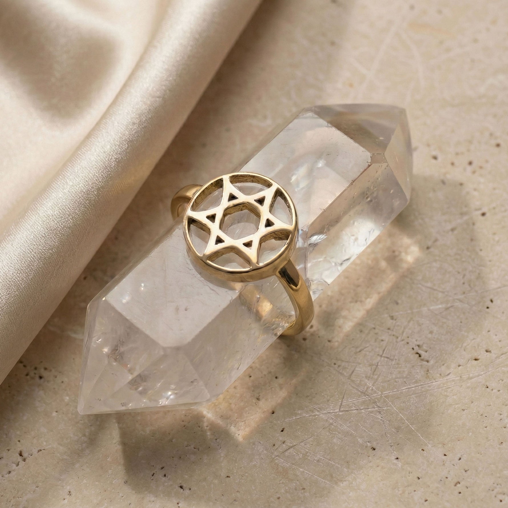 Curved Star of David Ring in 18K Gold Vermeil displayed on a crystal