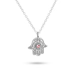 Silver Hamsa hand pendant necklace with a red gemstone on a white background