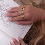 Model tracing over sacred geometry with Divine Eye Ring on hand