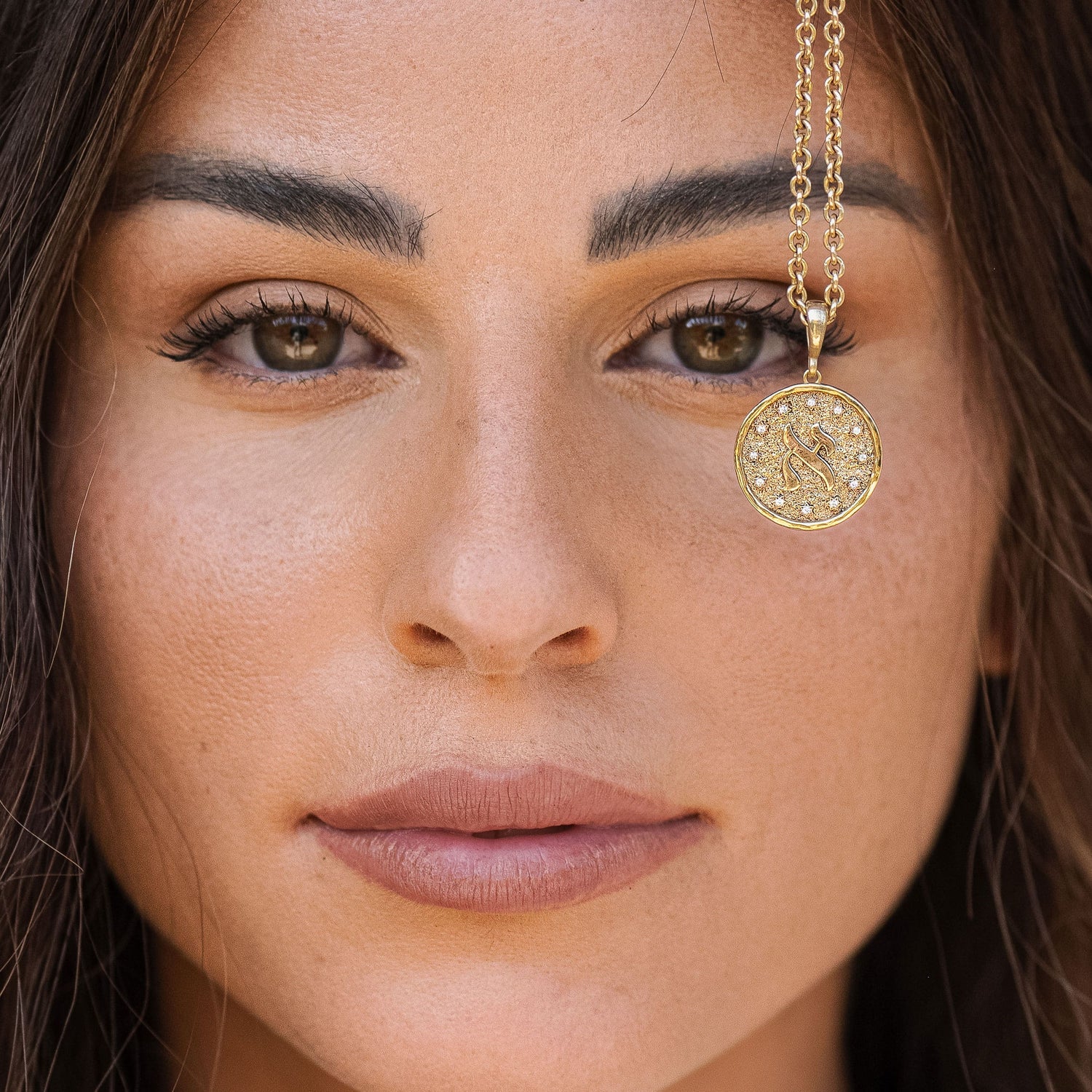 Model headshot wearing Aleph pendant necklace