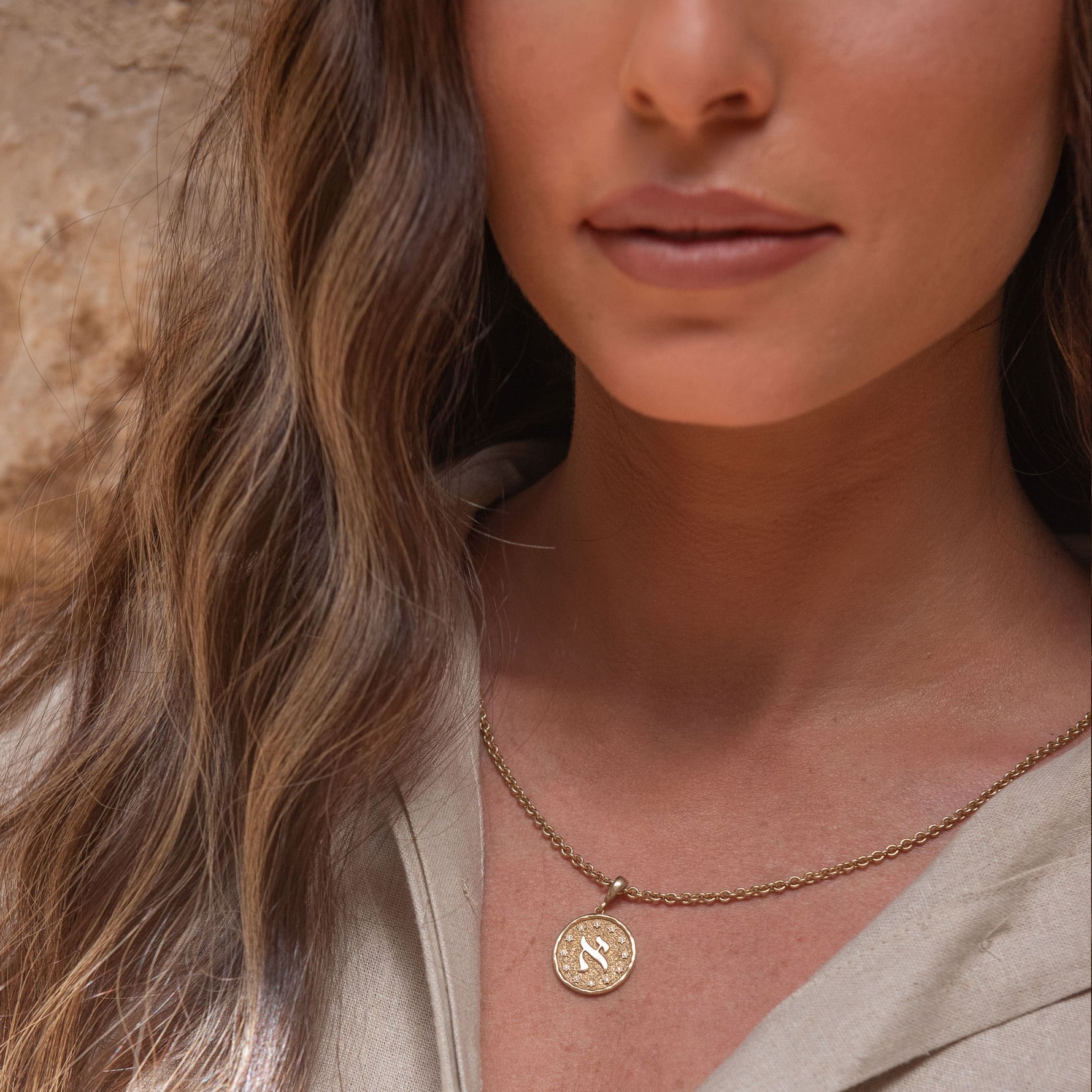 Model profile showing Aleph pendant layered chains