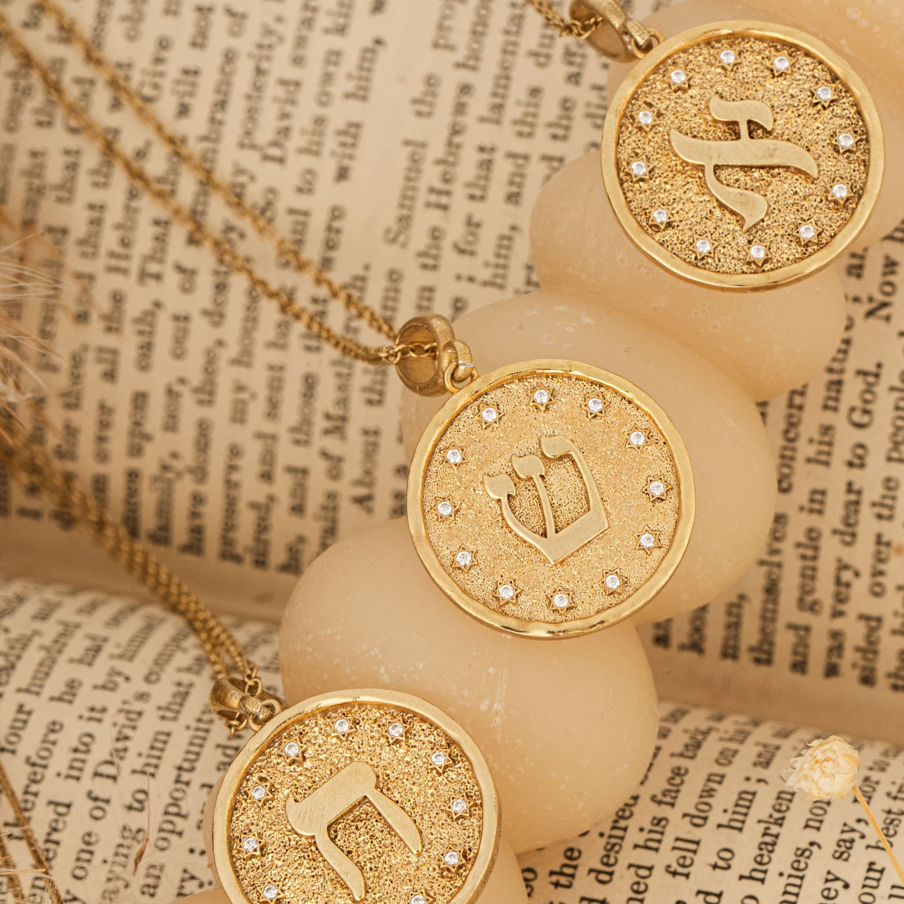 Aleph pendants lined on parchment scroll soft light