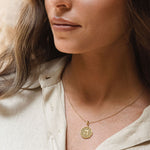 Model wearing letter Hey pendant layered necklaces
