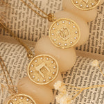 Shin pendants arranged on parchment scroll