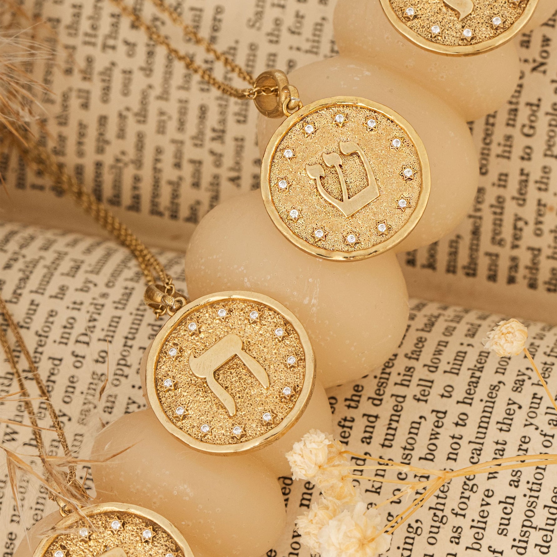 Shin pendants arranged on parchment scroll