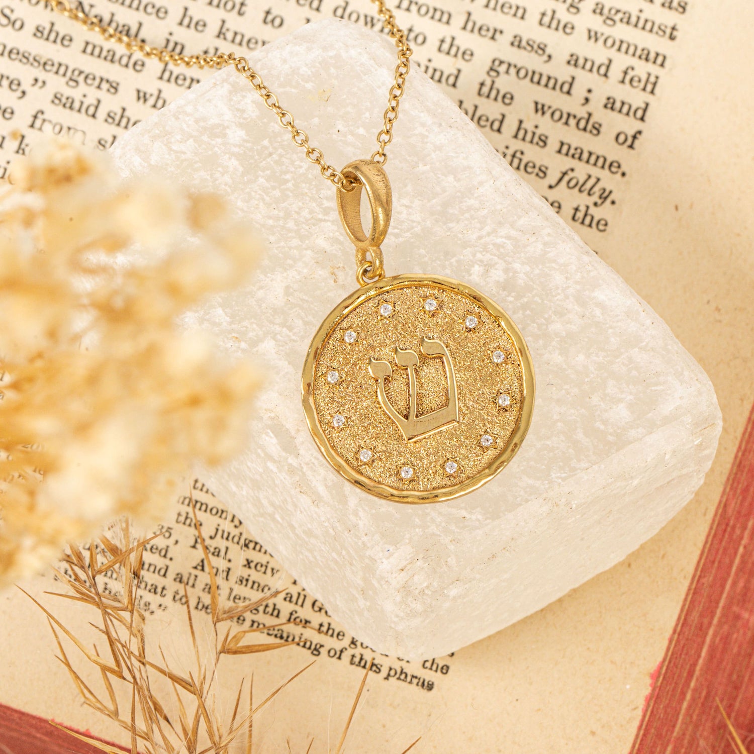 Shin pendant on cream stone  on text