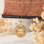 מהש pendant hanging against antique book with florals