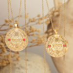 מהש pendants with ruby accents on linen cloth