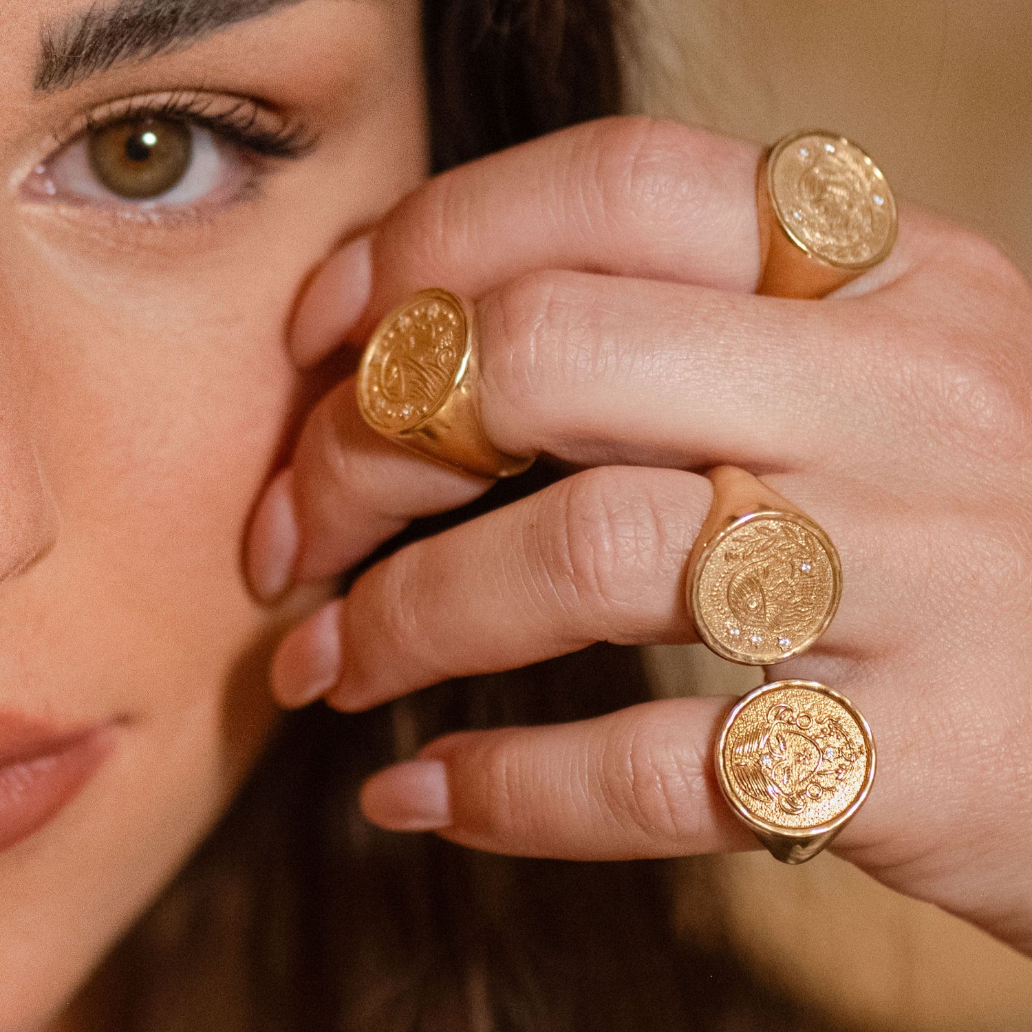 Rachel Ring worn on model’s finger with soft-focus face in background