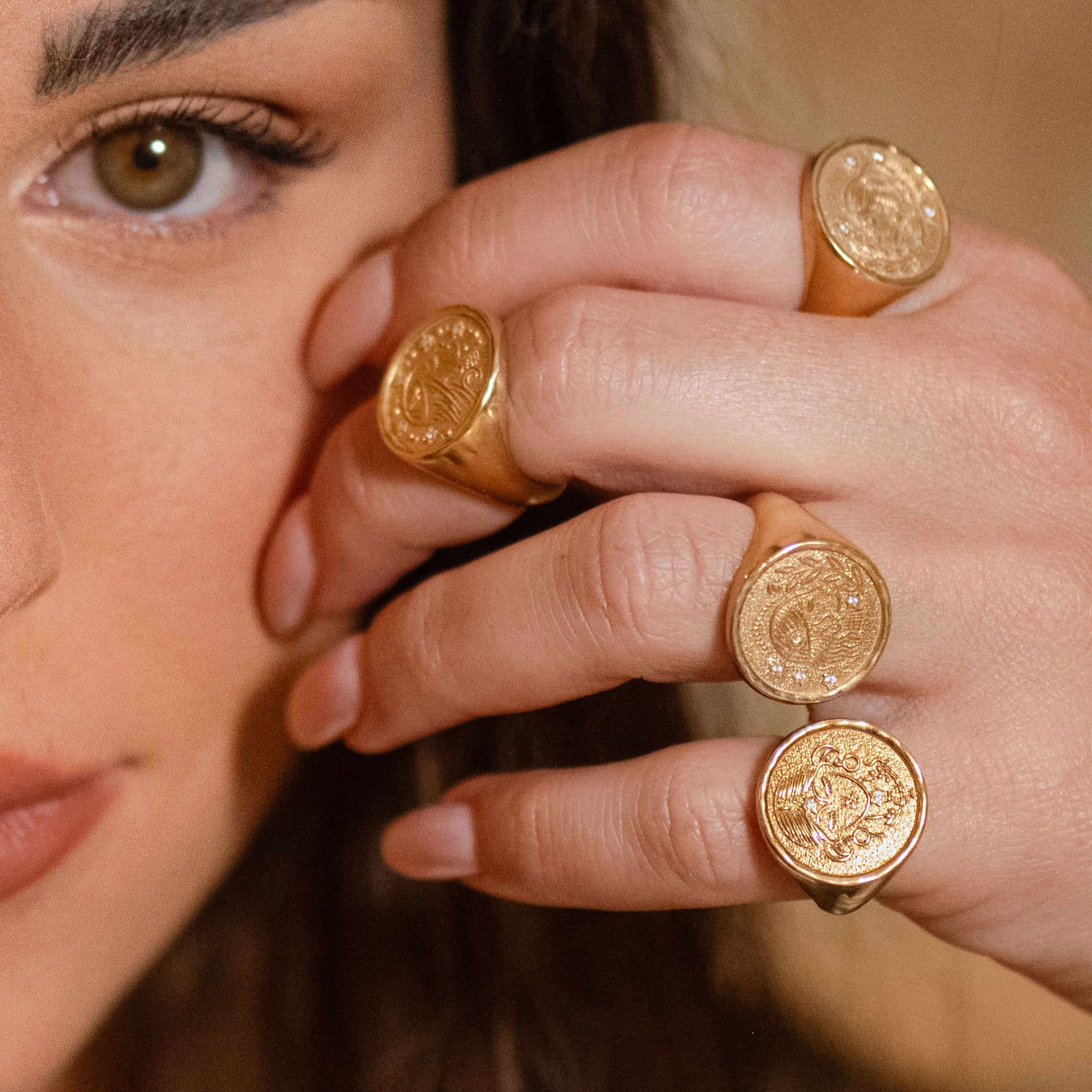 Rachel Ring worn on model’s finger with soft-focus face in background