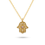 Studio view of the gold Radiant Anchor Hamsa necklace on a clean white background.