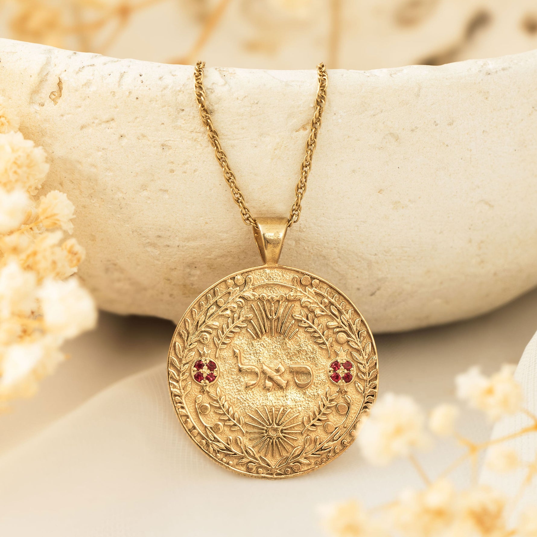 סאל pendant draped on ceramic bowl with dried florals
