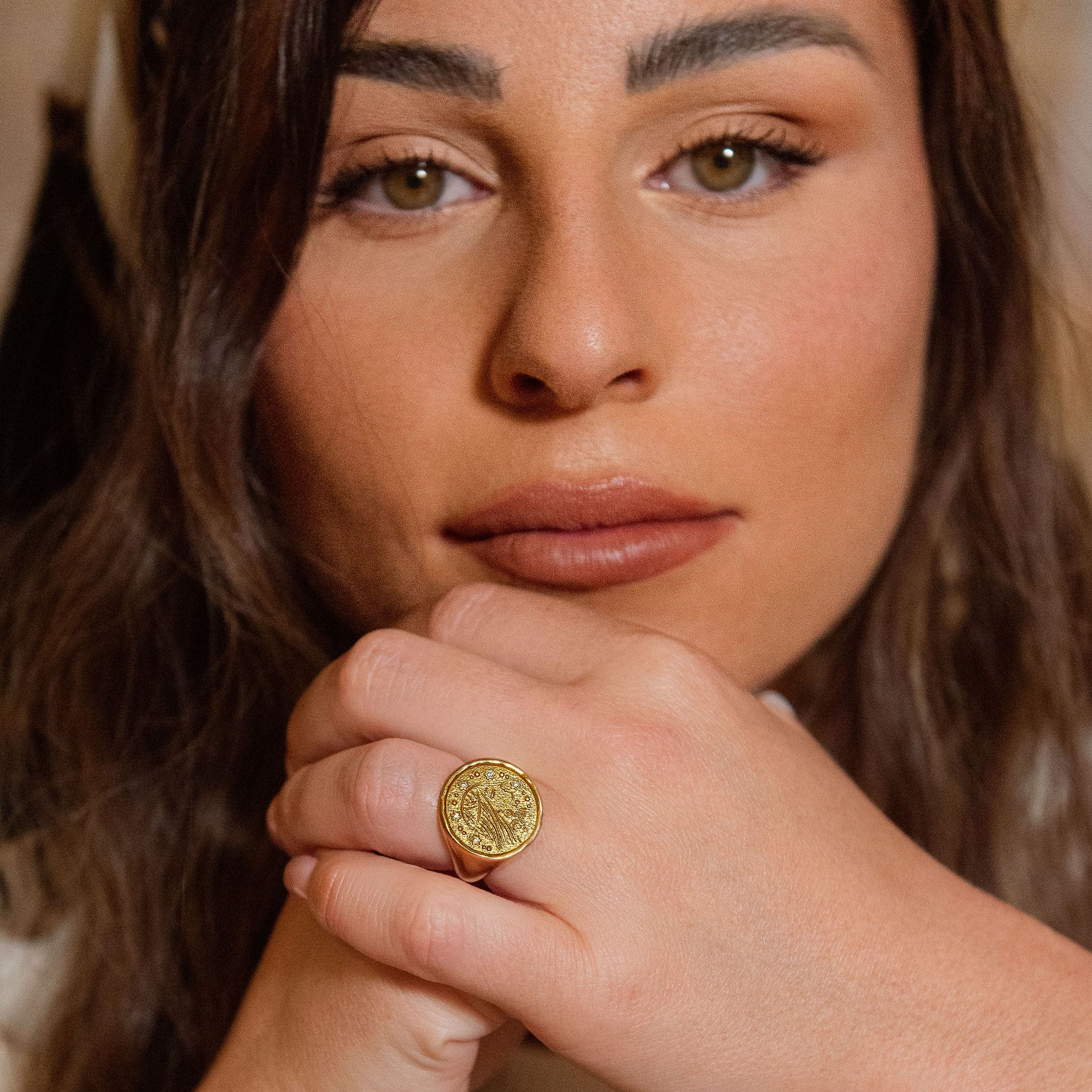 Model wearing the Sarah Ring with a modern Jewish head covering, warm indoor setting, gentle pose