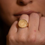 Close-up of Sarah Ring worn on hand in low-light dramatic setting