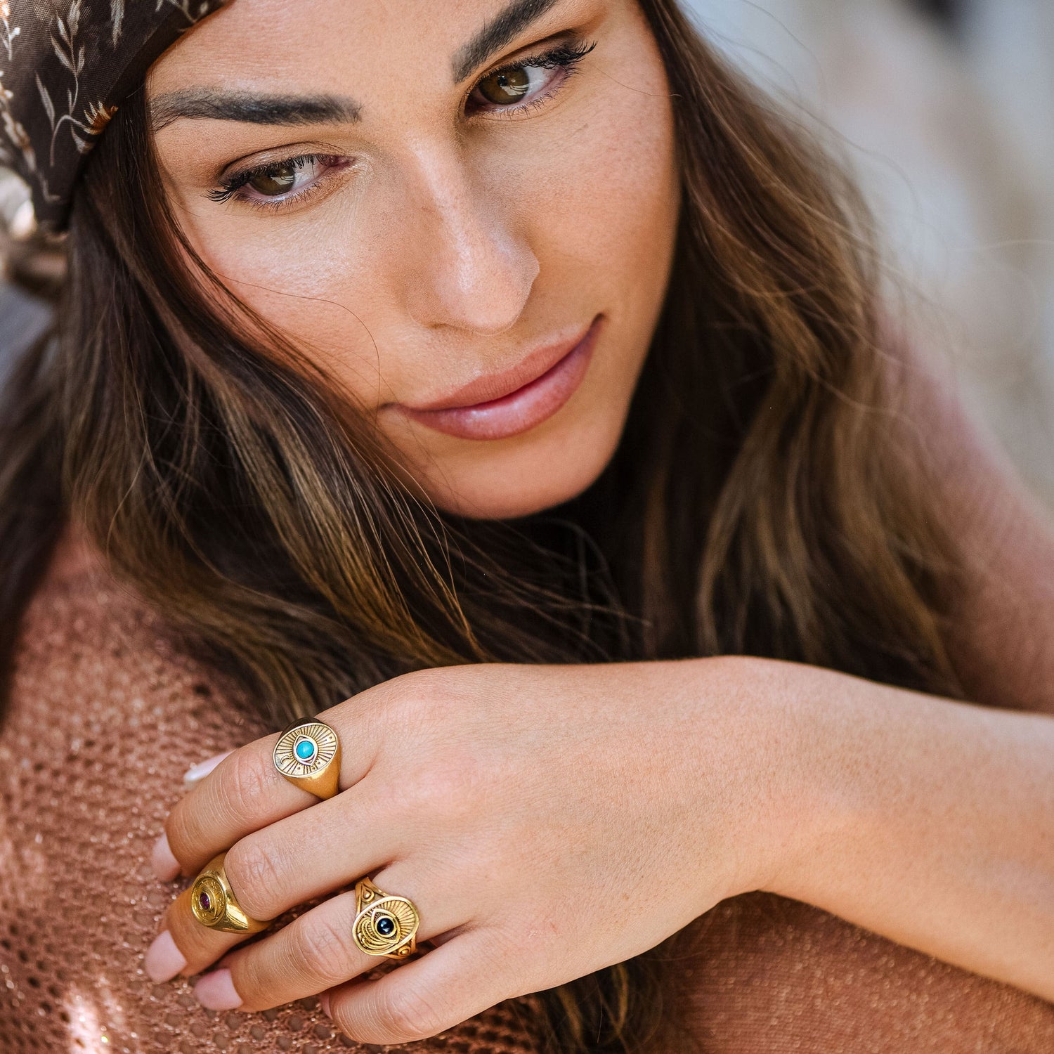 Model wearing Window to the Soul Ring outdoors in warm sunlight