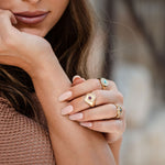 Model wearing Wisdom & Sefirot Ring with ruby, natural expression and styling